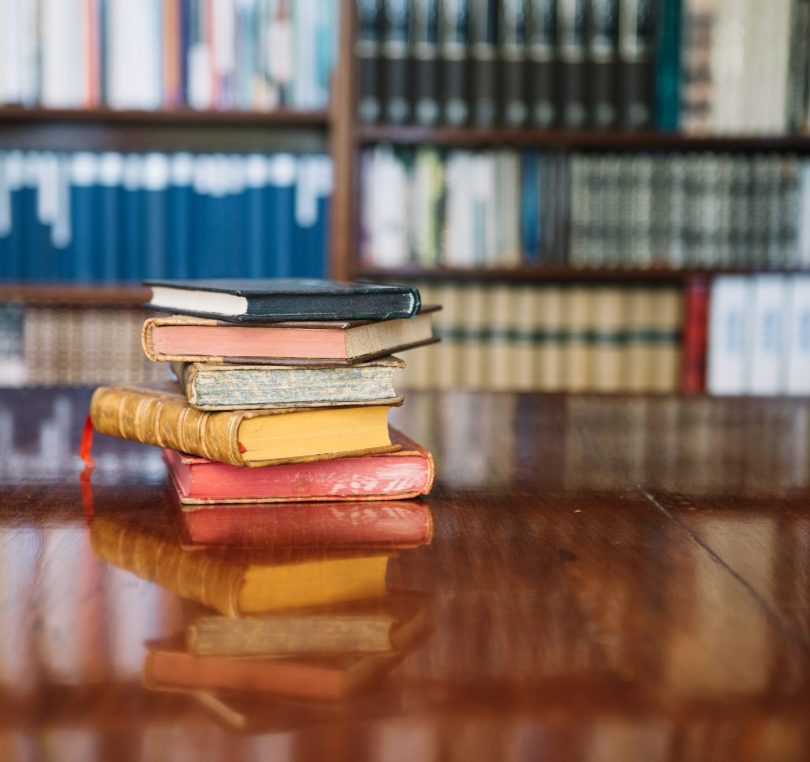 stack-old-books-library-table
